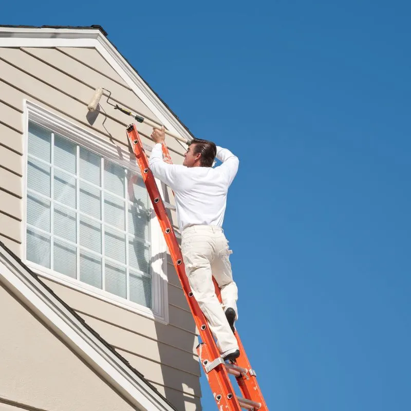 Residential home in Dubai being painted with eco-friendly colors under premium residential painting services.